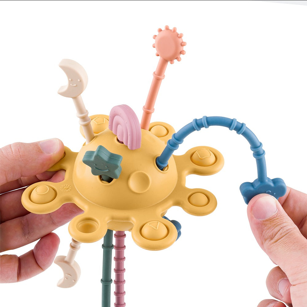 Petite&Mars Crazy Planet Juguete sensorial de silicona y mordedor 10m+